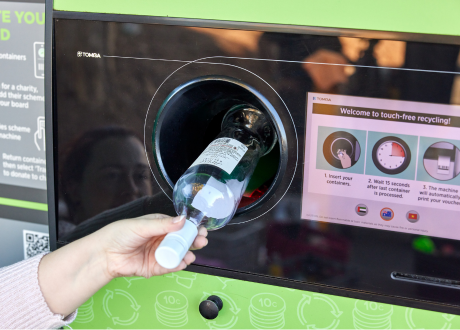 Wine bottle being inserted into Reverse Vending Machine
